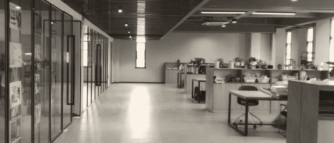 A bright, minimal corridor inside the iTEX facility